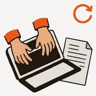 Hands typing on a laptop next to a paper